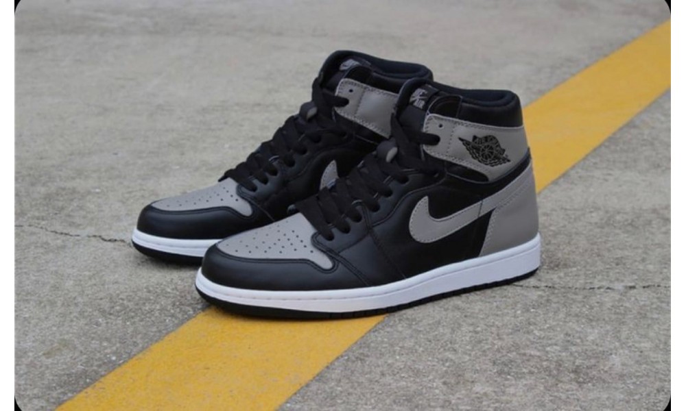 Black and grey jordan hotsell retro 1